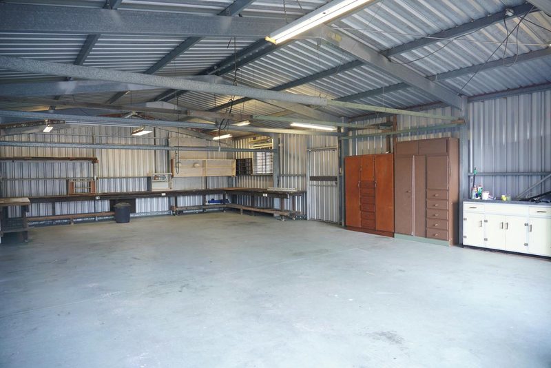 Empty residential workshop with broom-finish concrete floor